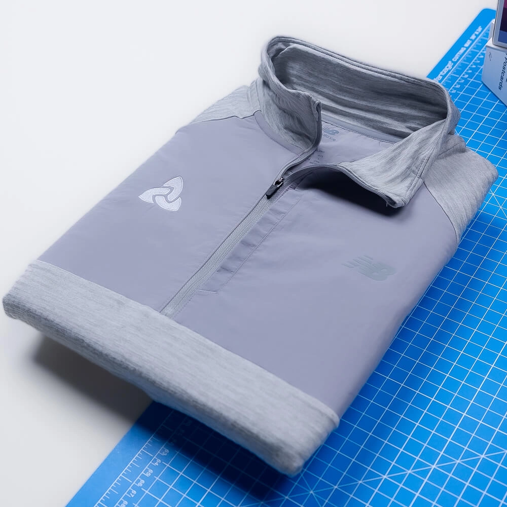 Branded New Balance apparel makes welcome baskets, onboarding kits, and event gifts memorable. 